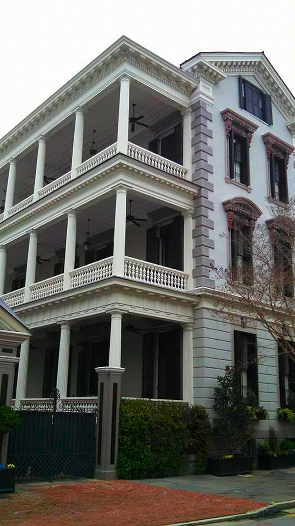 Exterior painting in Tallahassee, three stories of white porches and railings